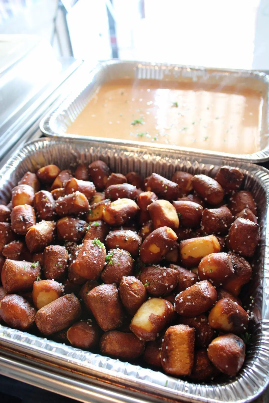 Soft pretzel bites with a pan of beer cheese