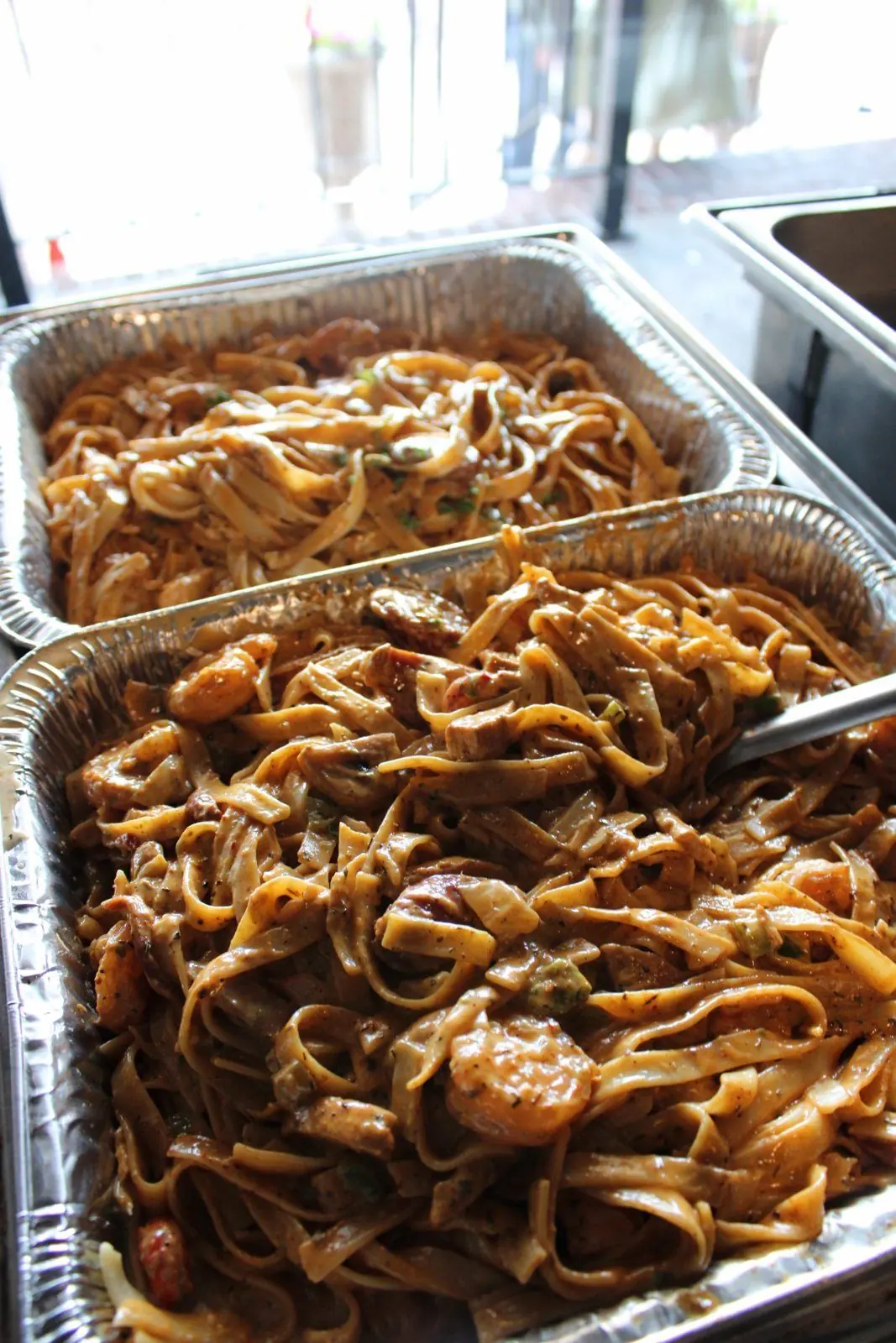 Pans of Rougaroux, Creole cream pasta with shrimp and sausage