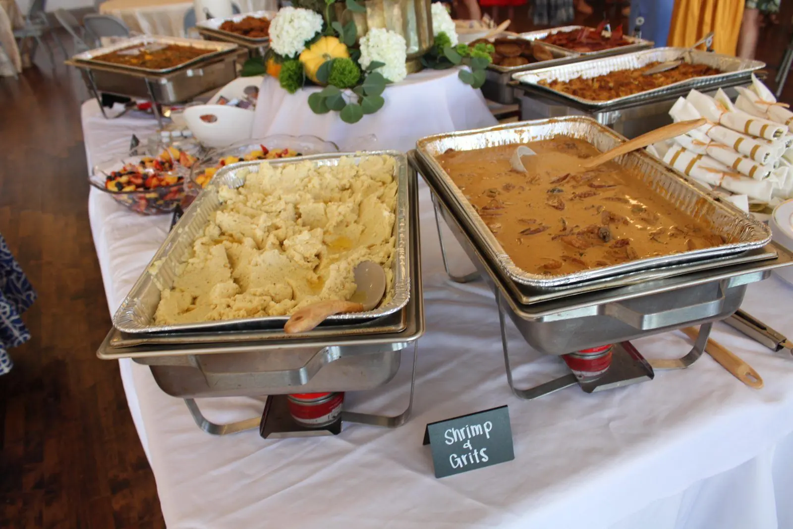 Catered shrimp and grits in chafing dishes
